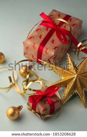 christmas gifts and tree decorations balls and star

