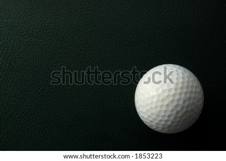 golf ball in corner of green background