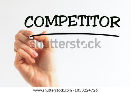 Hand writing inscription COMPETITOR costs with black marker, concept, stock image