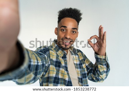 Young african man take selfie isolated on white background