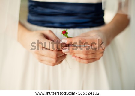 bride with strawberry in the hands