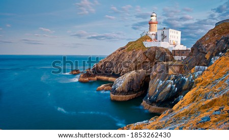 The Baily Lighthouse, Howth. co. Dublin, Baily Lighthouse on Howth cliffs, View of the Baily Lighthouse from the cliff Royalty-Free Stock Photo #1853262430