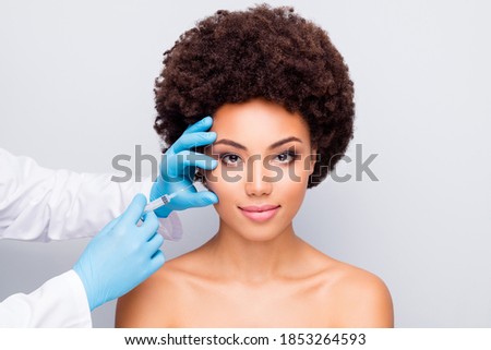 Close-up portrait of her she nice-looking attractive calm perfect well-groomed wavy-haired girl doc making prick beautician isolated on light white gray color pastel background