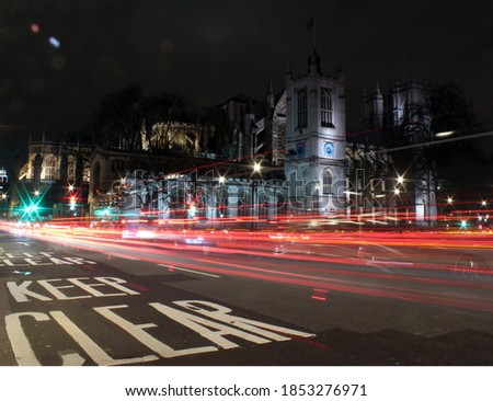 Long-exposure photo of cars driving through the streets of London