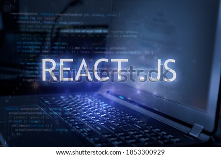 React .js inscription against laptop and code background. Learn react programming language, computer courses, training.  Royalty-Free Stock Photo #1853300929