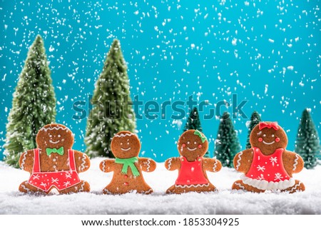 Christmas Greeting Card. Gingerbread Funny Family Outdoor in Snow.