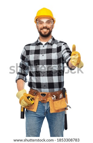 profession, construction and building - happy smiling male worker or builder in helmet and goggles showing thumbs up over white background