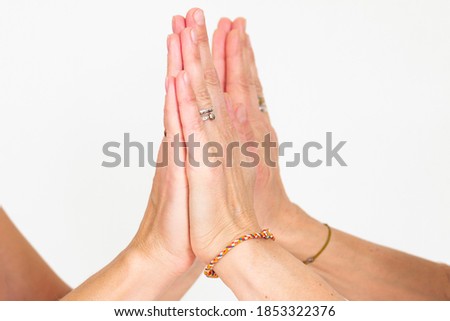 women joined hands with palms, close-up