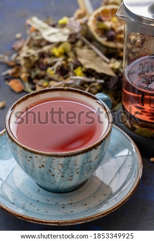 winter tea in a cup on a black and blue background
