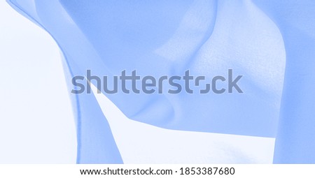 Pale blue silk, woven silk fabric, blue turquoise textured background, tone, texture, pattern