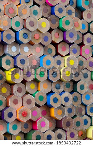 Collection of coloured pencils in a diagonal line pattern as background picture
