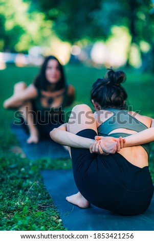 Mindfulness and Meditation. Women Doing Yoga by the Lake 