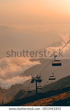 View from the trekking trail Rosa Khutor Ski Resort, Sochi, Russia. Sunset in the mountains at Roza Pik, height 2320 meters