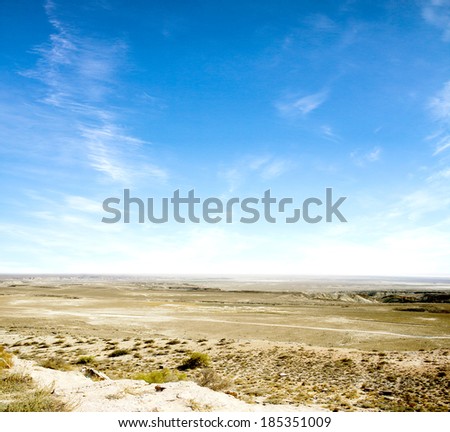 desert  against a blue sky with clouds