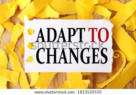 adapt to changes, text on white paper with torn paper background