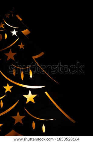 New Year's card mockup. new year tree on a black background. Christmas tree lights