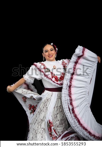 Latin woman dancer wearing dress from Aguascalientes Mexico, black background, with white dress with wine-colored ribbons, moving her skirt and smiling