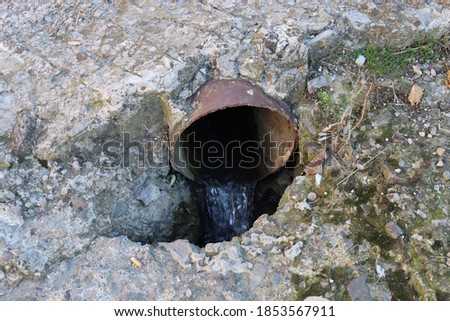 drain pipe in a concrete road