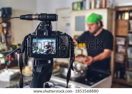 Backstage of a shooting of a cooking tutorial video. Royalty-Free Stock Photo #1853568880