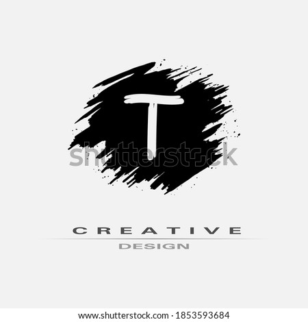 Letter T Logo With Brush Stroke and Splatter Elements. Handwritten Brush Stroke letter T logo design. Creative template suitable for company, logotype, emblem, monogram, jewelry, cosmetic, brand name.