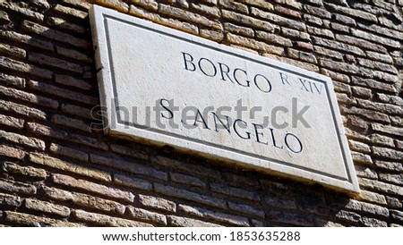 Marble street plate on the wall of the Il Passetto di Borgo, elevated walkway about 800 m long connecting the Vatican with Castel Sant'Angelo in Rome