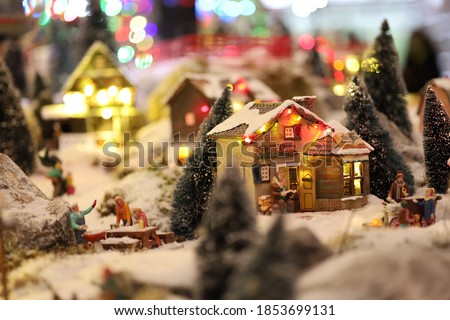 Miniature of Christmas scene old house in snow with winter concept, street, outdoor Christmas holidays