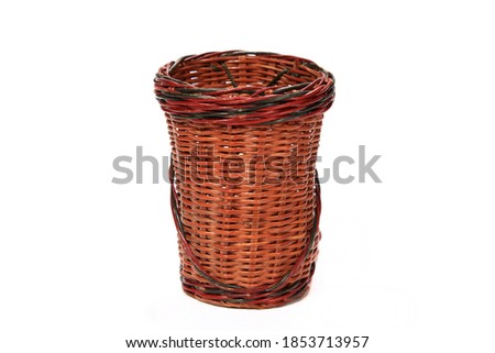 A closeup shot of a woven basket isolated on a white background