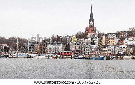 Flensburg landscape, German town in winter season. Coastal skyline under cloudy sky