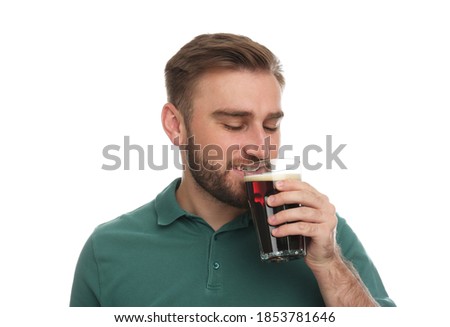 Handsome man with cold kvass on white background. Traditional Russian summer drink