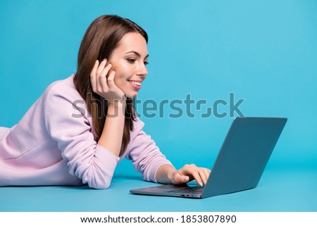 Profile side photo of college student girl lying floor study remote laptop have teacher tutor university seminar wear lilac violet jumper isolated over blue color background