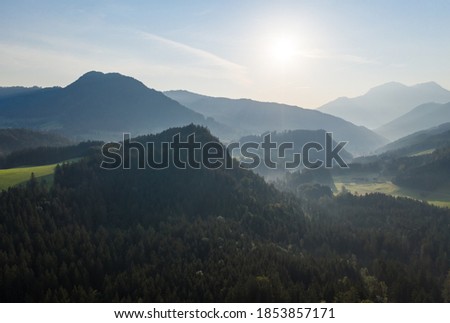Drone panorama over forest and mountains in Bavaria, Germany . Royalty-Free Stock Photo #1853857171