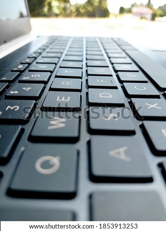 A computer keyboard is a typewriter-style device which uses an arrangement of buttons or keys to act as mechanical levers or electronic switches. Royalty-Free Stock Photo #1853913253
