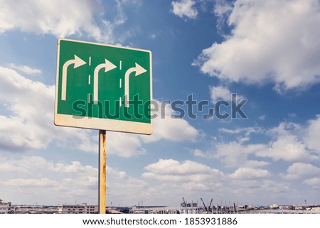 Traffic signs turn right with clouds and sky background
