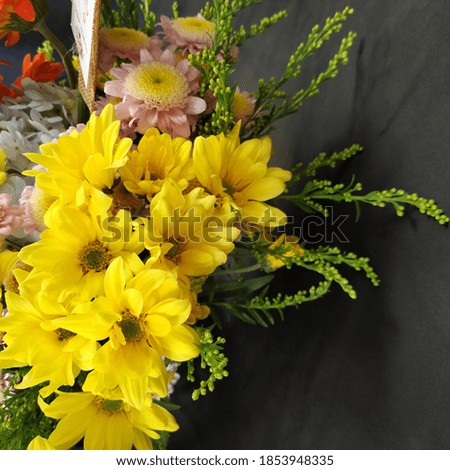 yellow daisies in the flower arrangement