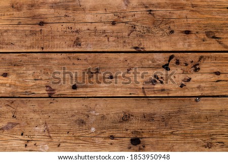Dark old wooden table texture background top view. cracked board.