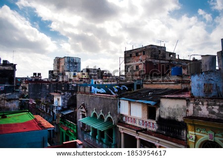 Aerial panoramic view of an old and destroyed city where there are houses and people live. Havana Cuba
