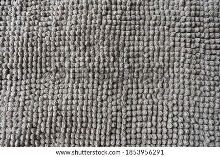 Texture of a gray blanket made of small balls