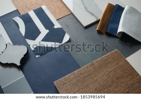 Moodboard. Material samples. Blue, gray, white, black, gold, warm wood.                       Royalty-Free Stock Photo #1853985694