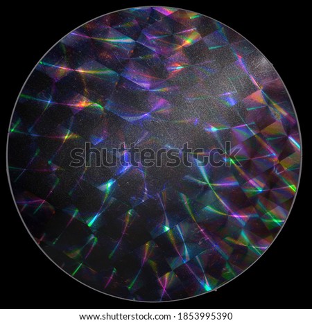 macro top shot photo of holographic foil sticker with cool grid pattern texture, holo sticker on real paper sheet isolated on black background with nice light reflections and scratches. Royalty-Free Stock Photo #1853995390