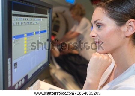 doctor checking on calendar for appointment with patient
