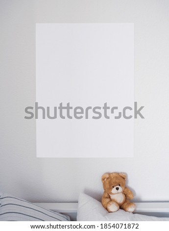 a2 mockup poster in kids room with teddy bear