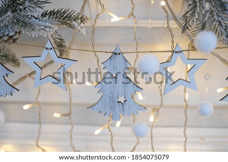 Christmas wooden decorations garlands on a white background