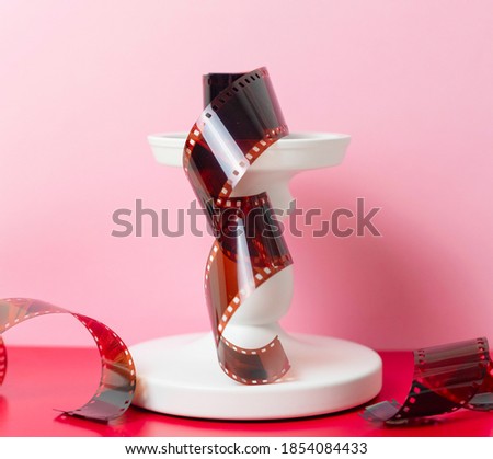 Film for photos on a pedestal on a colored background