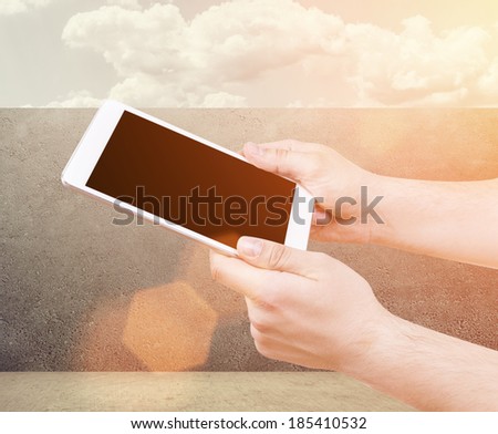 isolated Man hand holding the phone tablet touch computer gadget