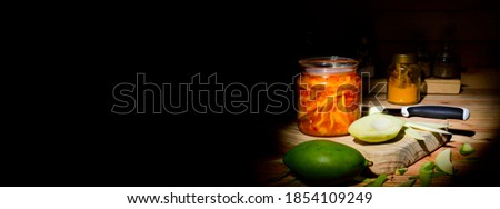 Indian mango pealed and pickled in hot spices
