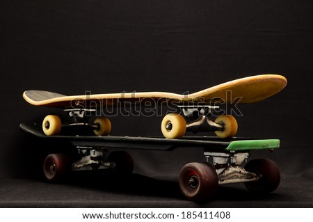Vintage Style Black Skateboard on a Dark Background