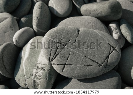 Striped sea stones. round pebbles. Pebbles