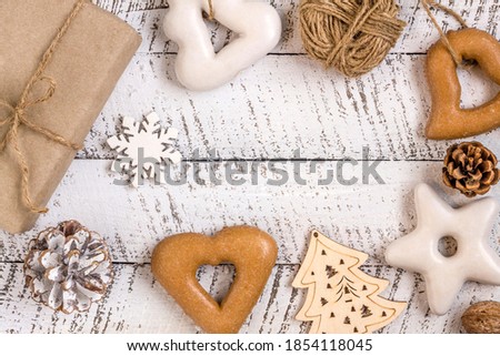 Merry christmas concepts with gift box, pastries and ornament element on white wooden table background.