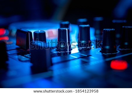 Audio controlling knobs on the music producer sound deck. 