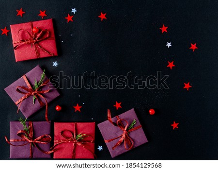 beautiful bright Christmas and New Year composition of gifts on a black background. Flat lay, copy space, top view